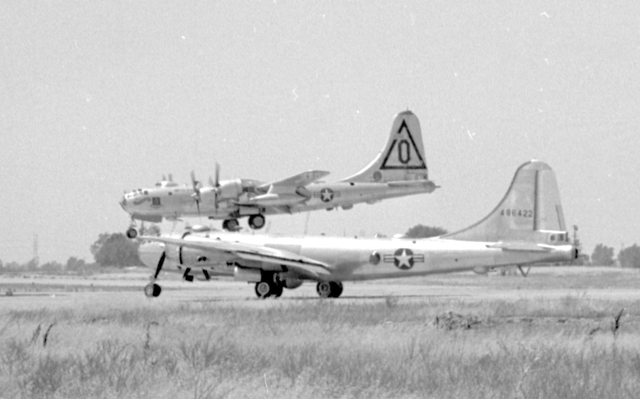 Photo showing side-by-side comparison of the B-29 and the B-50 ... B-29 Superfortress S/N 44-86422 taxis while B-50D 4854 lands at McClennan Field, Sacramento, California, circa 1948
